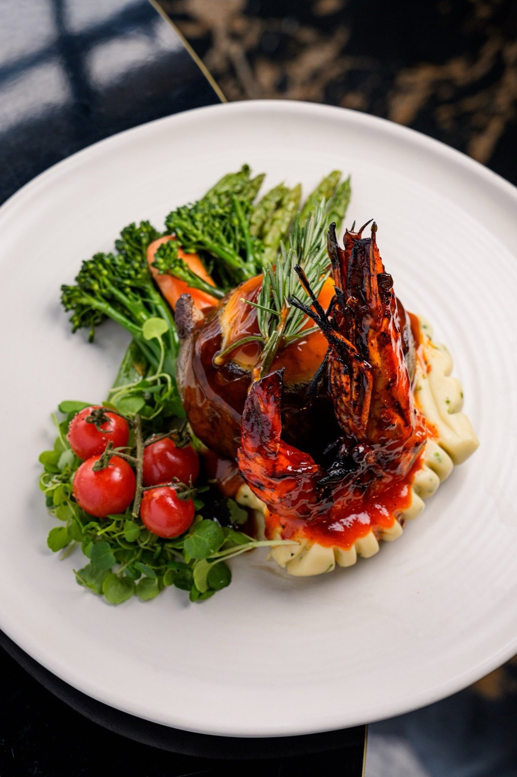 Grilled king prawns with seasonal vegetables at AVA Steakhouse